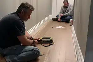 Consultation with a homeowner for baseboard installation